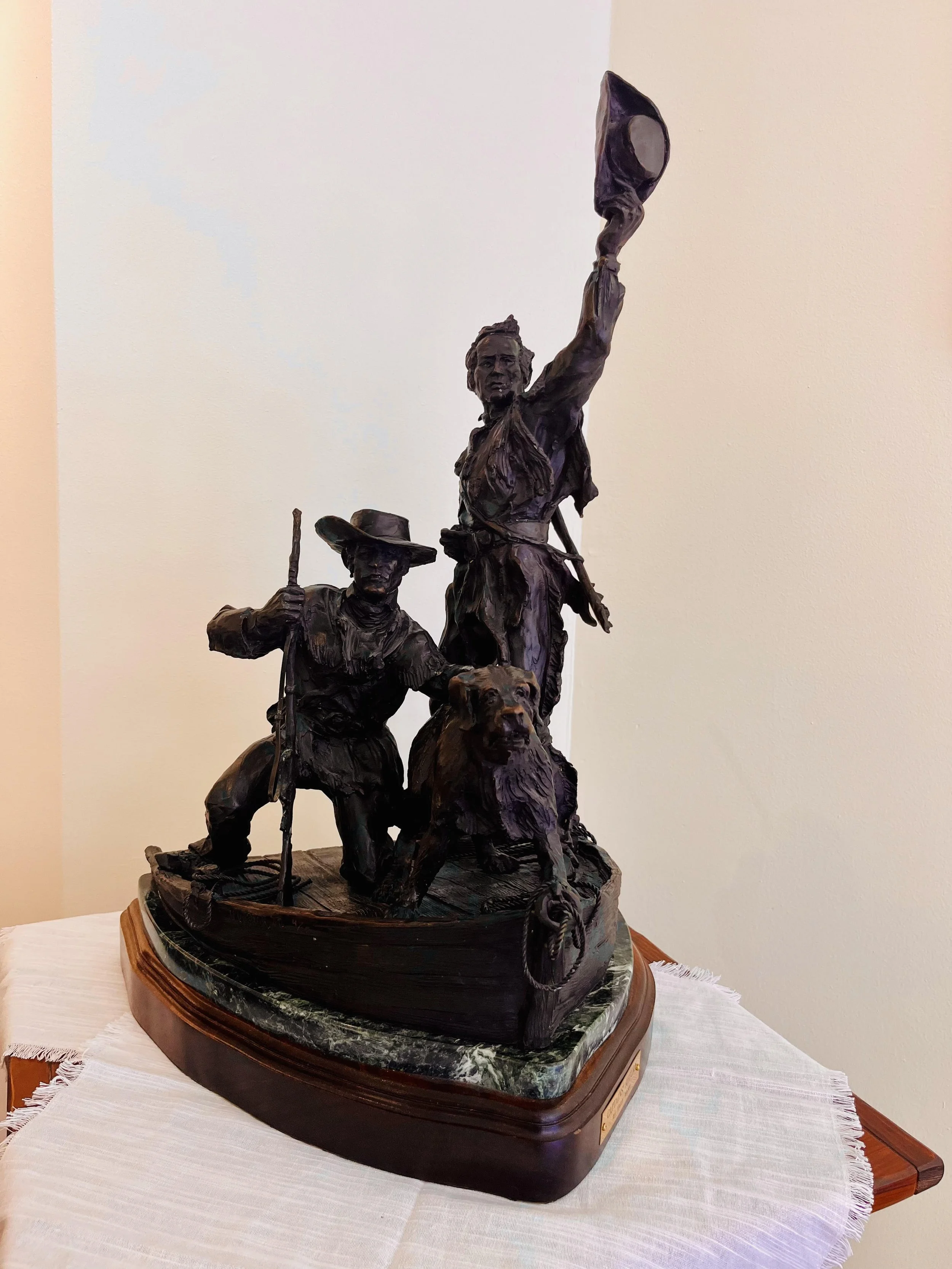  The Captains Return, Bronze, 16 x 27 x 15 inches 
 Bronze maquette depicting Meriwether Lewis, William Clark, and their dog Seaman returning to St. Louis after their journey to the Pacific Ocean. 