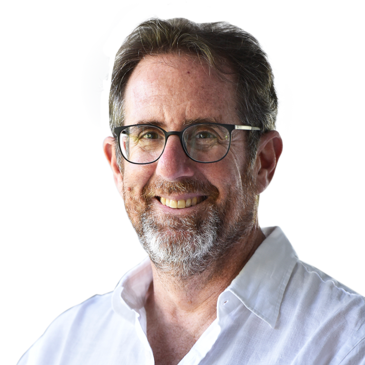 sideOUTsticks CEO, Yves Fogel, standing near waterfront with a city skyline and Brooklyn Bridge in the background, on a clear day.
