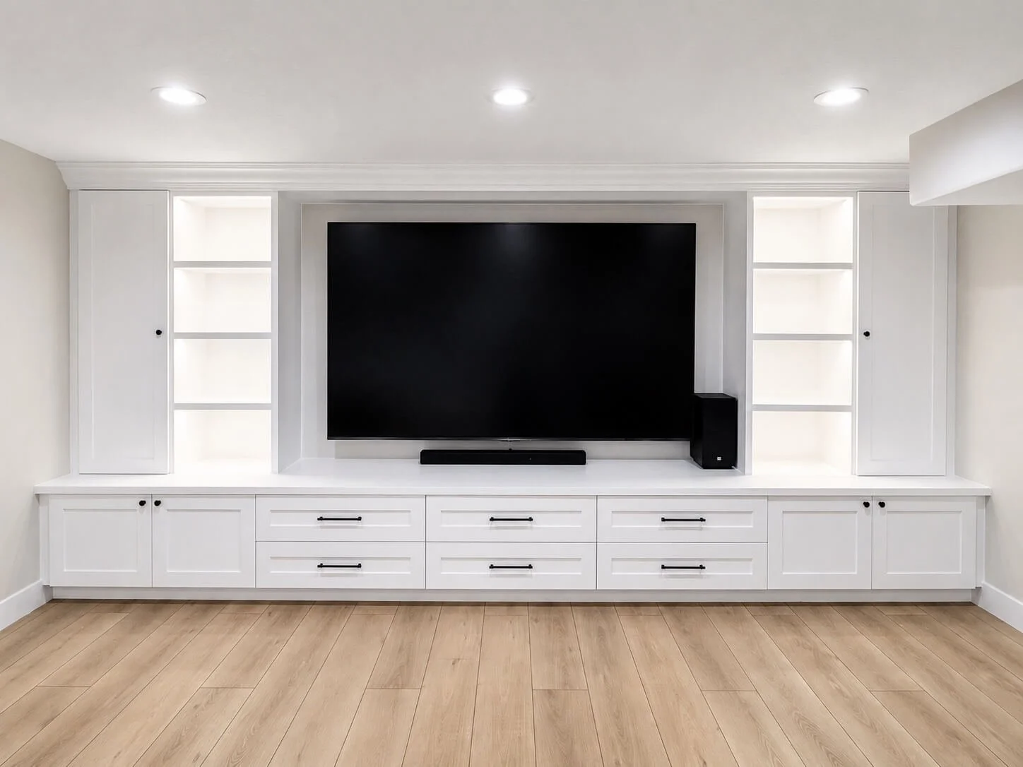 Living room entertainment center with custom white cabinetry