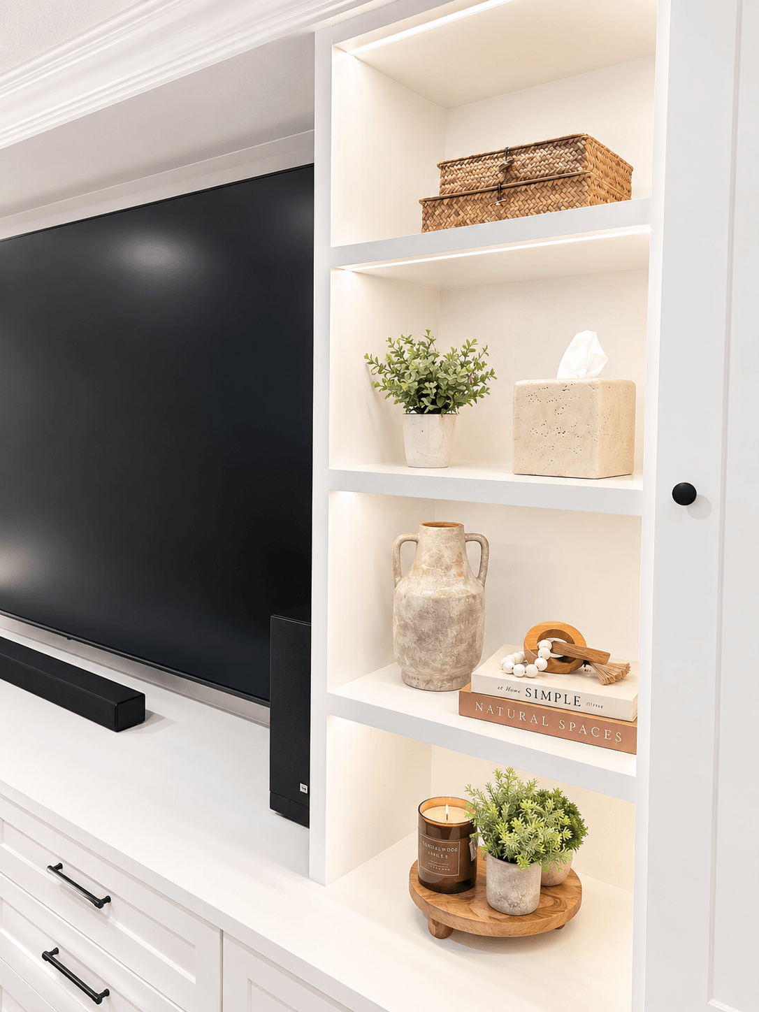 Custom shelves entertainment center - Haus Interiors.PNG