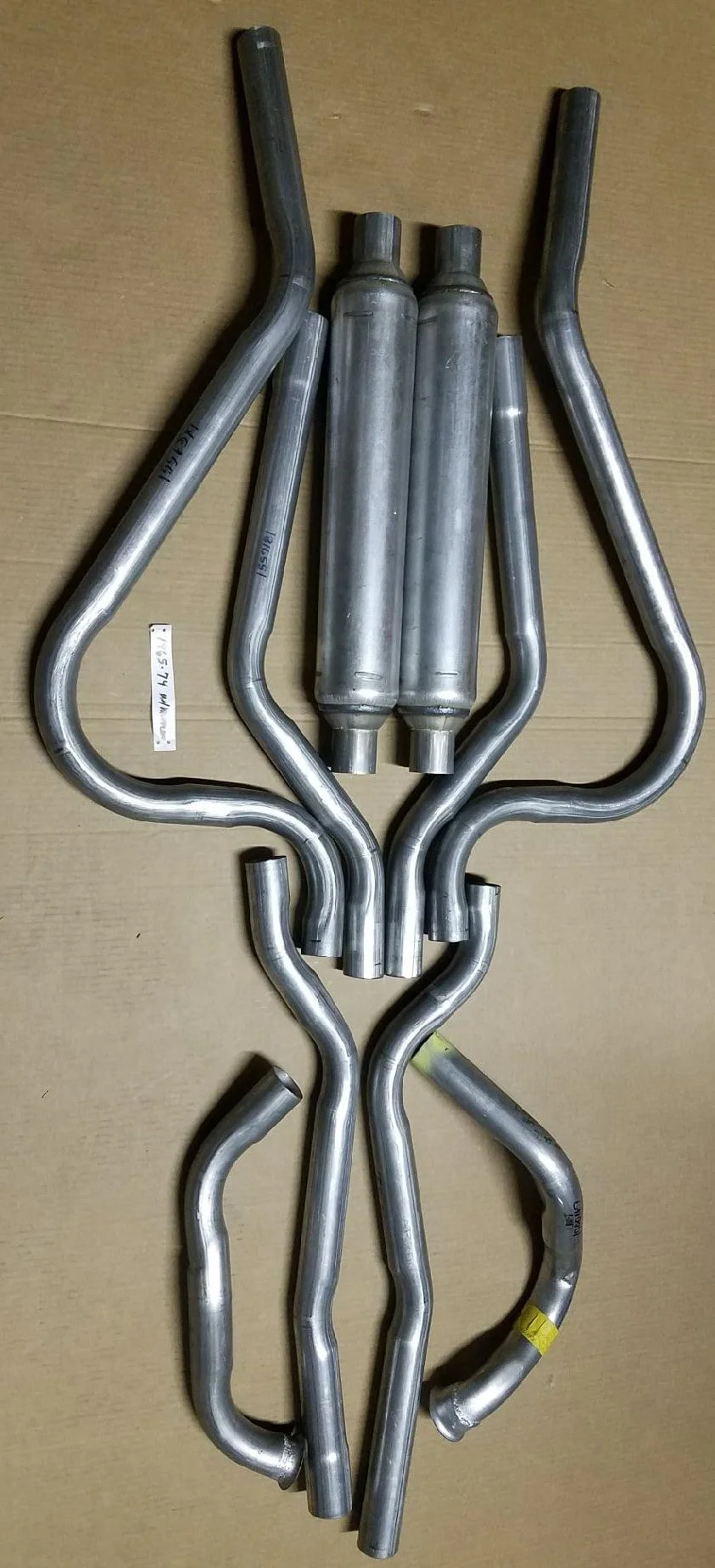 Complete 10-piece 409 stainless steel dual exhaust system with round seamless mufflers for 1966-1974 Avanti II models.
