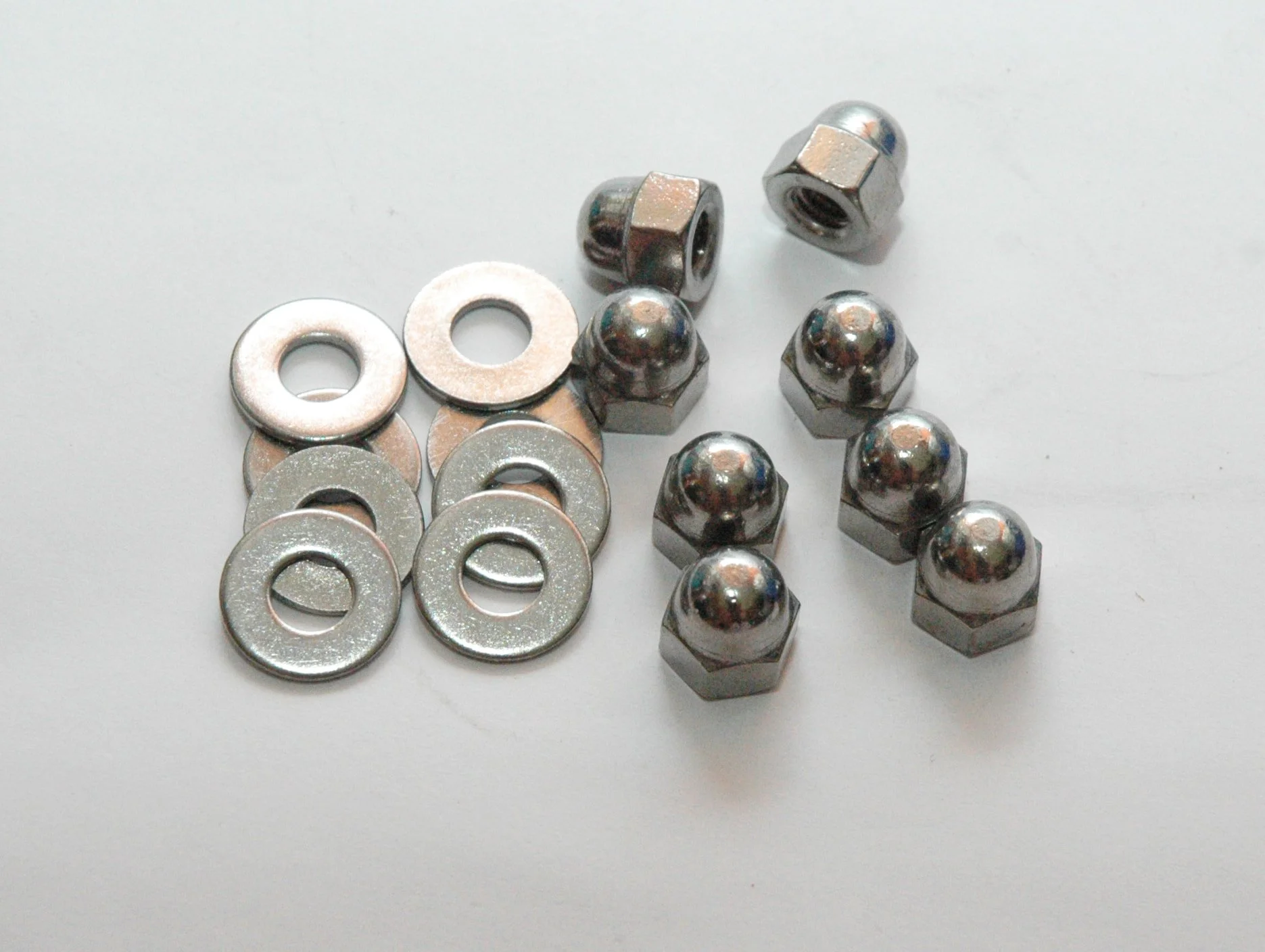 Stainless steel acorn nut and flat washer hardware kit for 1963-1964 Studebaker Avanti ignition shielding.