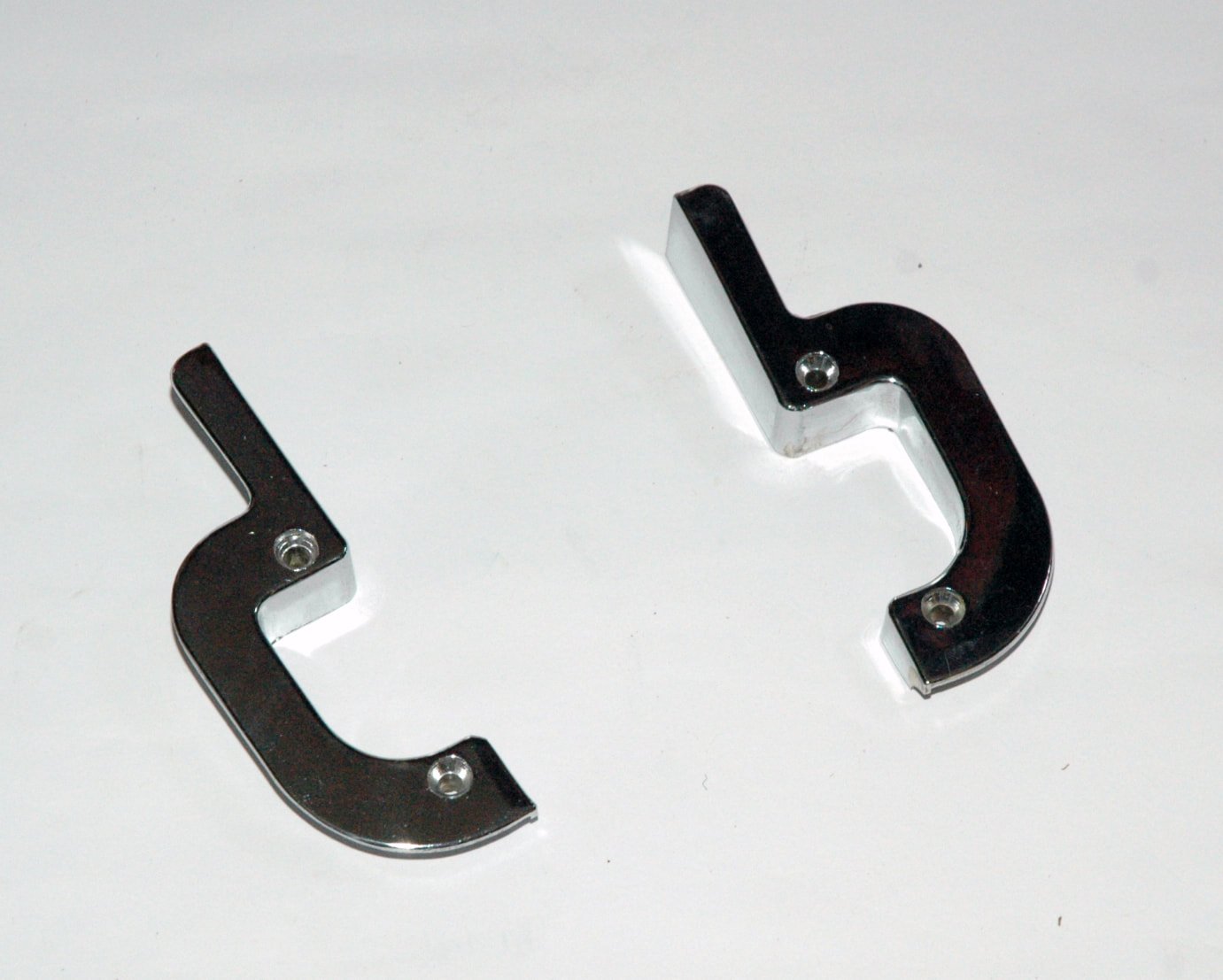 Pair of NOS Chrome Door Lock Escutcheons for 1963-1975 Studebaker Avanti and Avanti II, Parts 1350188 and 1350189