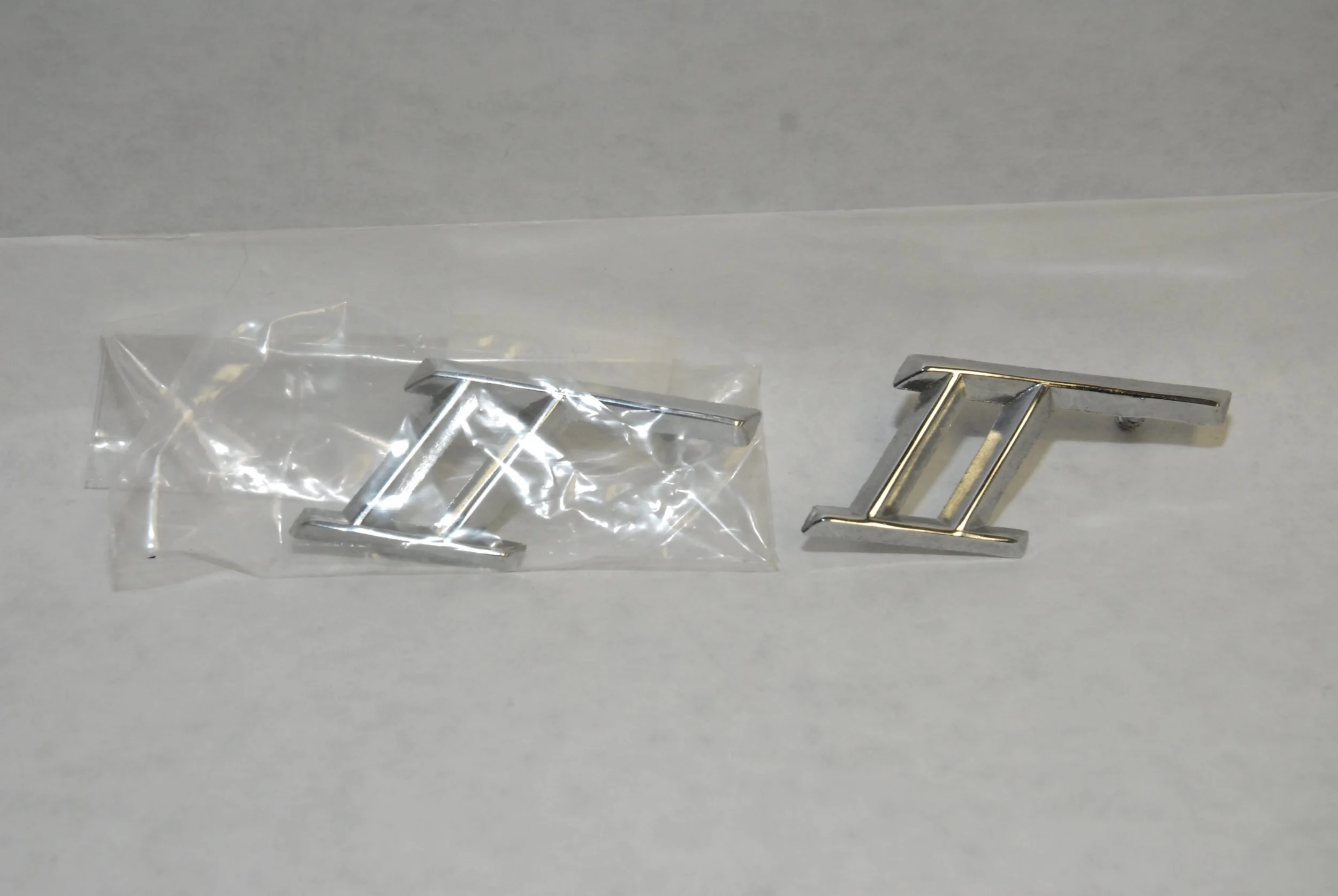 Genuine NOS Avanti II Roman Numeral Emblem Nameplate, Part 1700132