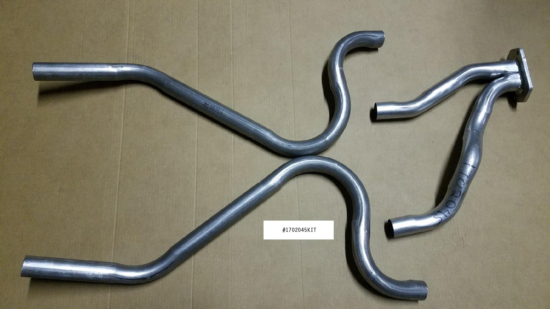 NOS 1984-1985 Avanti H.O. Aluminized Rear Exhaust Pipe Kit, Part 1702045KIT, featuring Y-pipe and tail pipes.