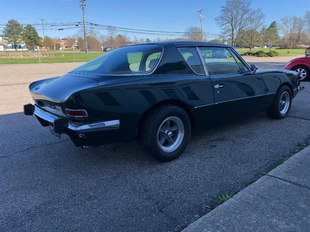 Rear view of a 1981 Avanti featuring new stainless dual exhaust and chrome bumpers.