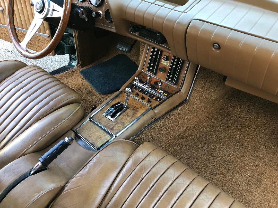 Classic Avanti dashboard featuring authentic Italian Ash wood and Nardi steering wheel.