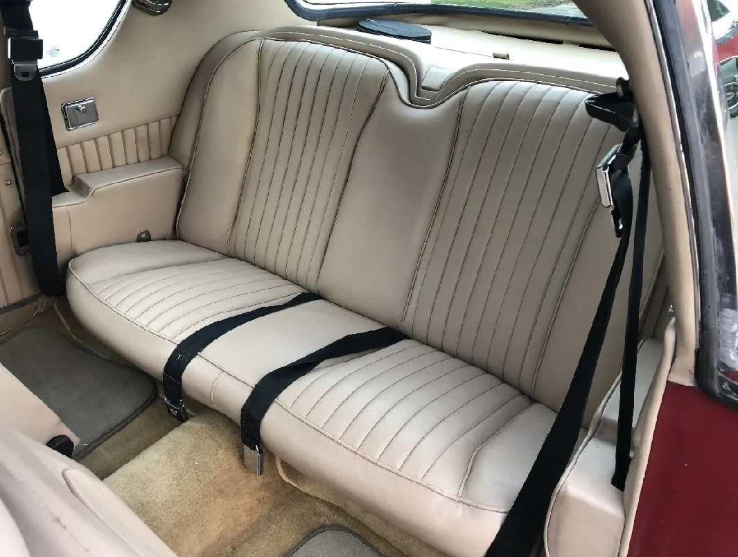 Close up of Bisque Leather Recaro seats in a 1983 Avanti II.