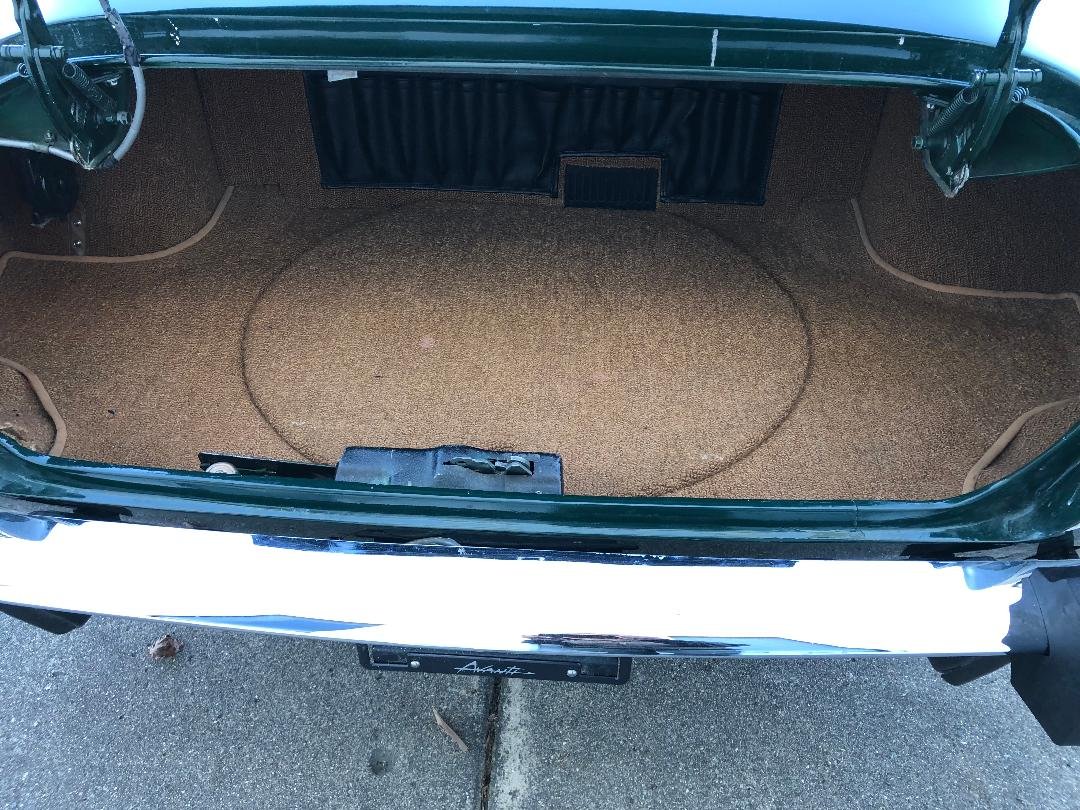 Clean, original interior of the trunk compartment on a 1981 Avanti II.