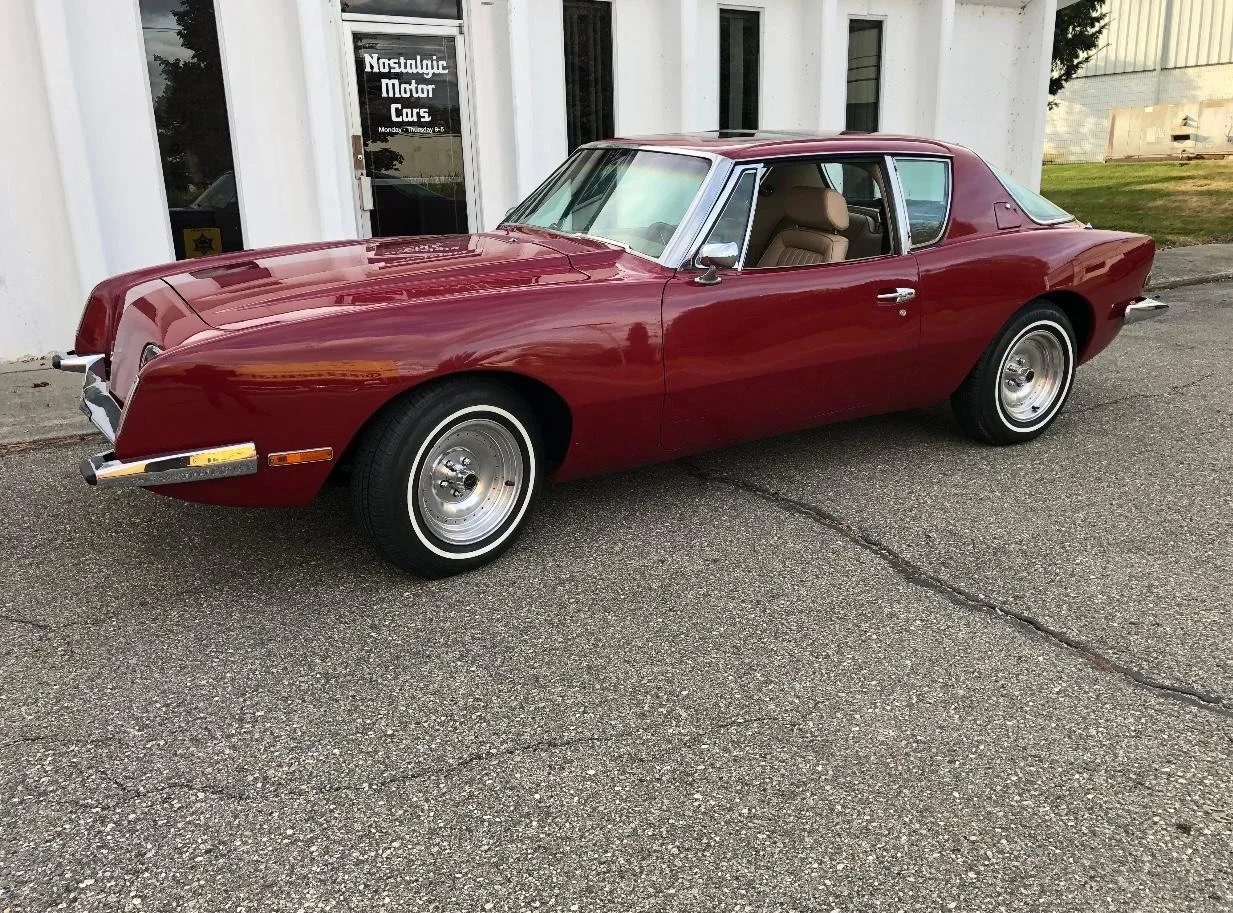 Detail of the Dark Red paint on a 1983 Avanti showing honest age and checking.