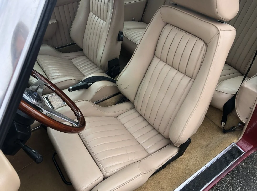 Close up of Bisque Leather Recaro seats in a 1983 Avanti II.
