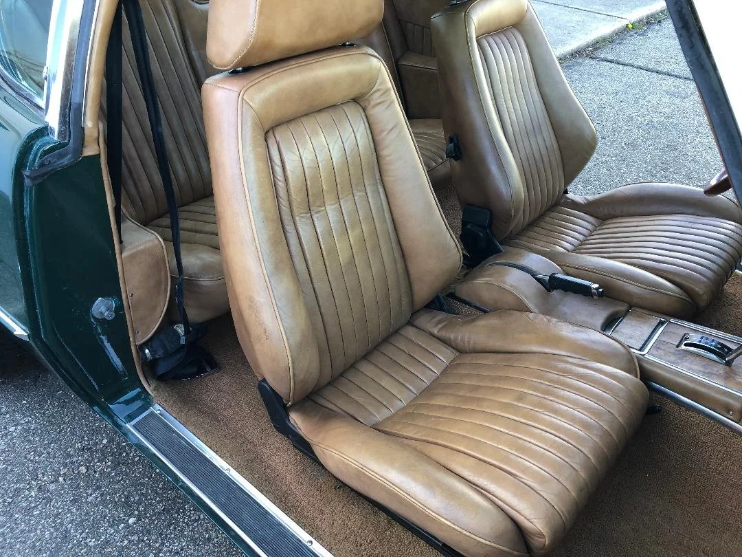 Tan leather Recaro front bucket seats in remarkable survivor condition.