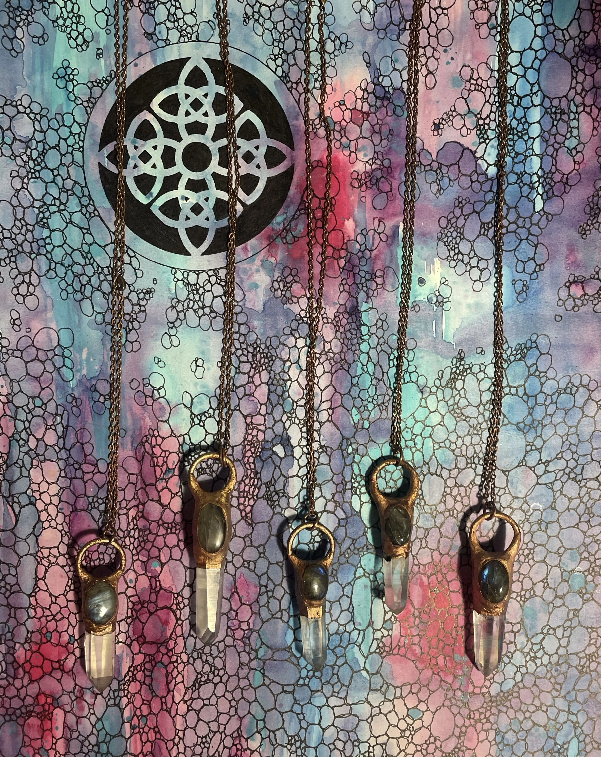 Electroformed Labradorite and quartz crystal pendants.