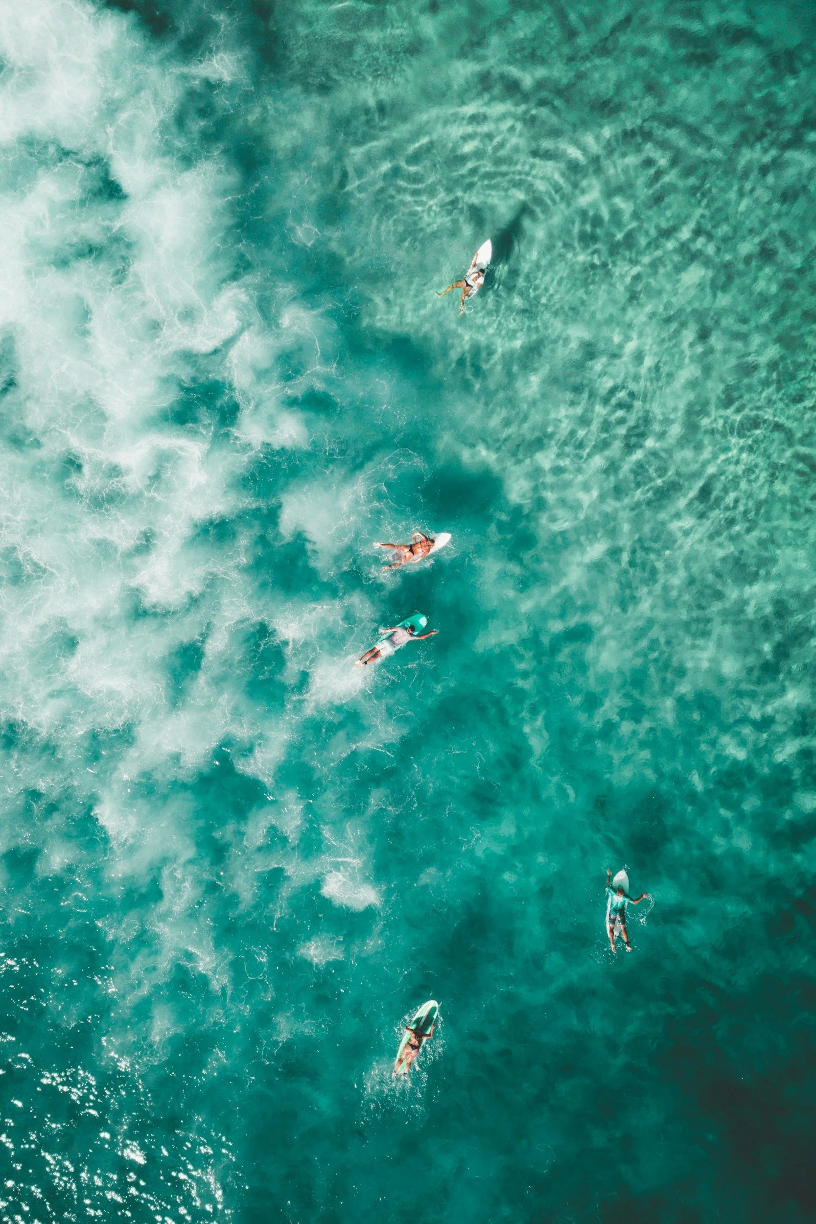 Surfers at the beach in Nicaragua on their surf boards