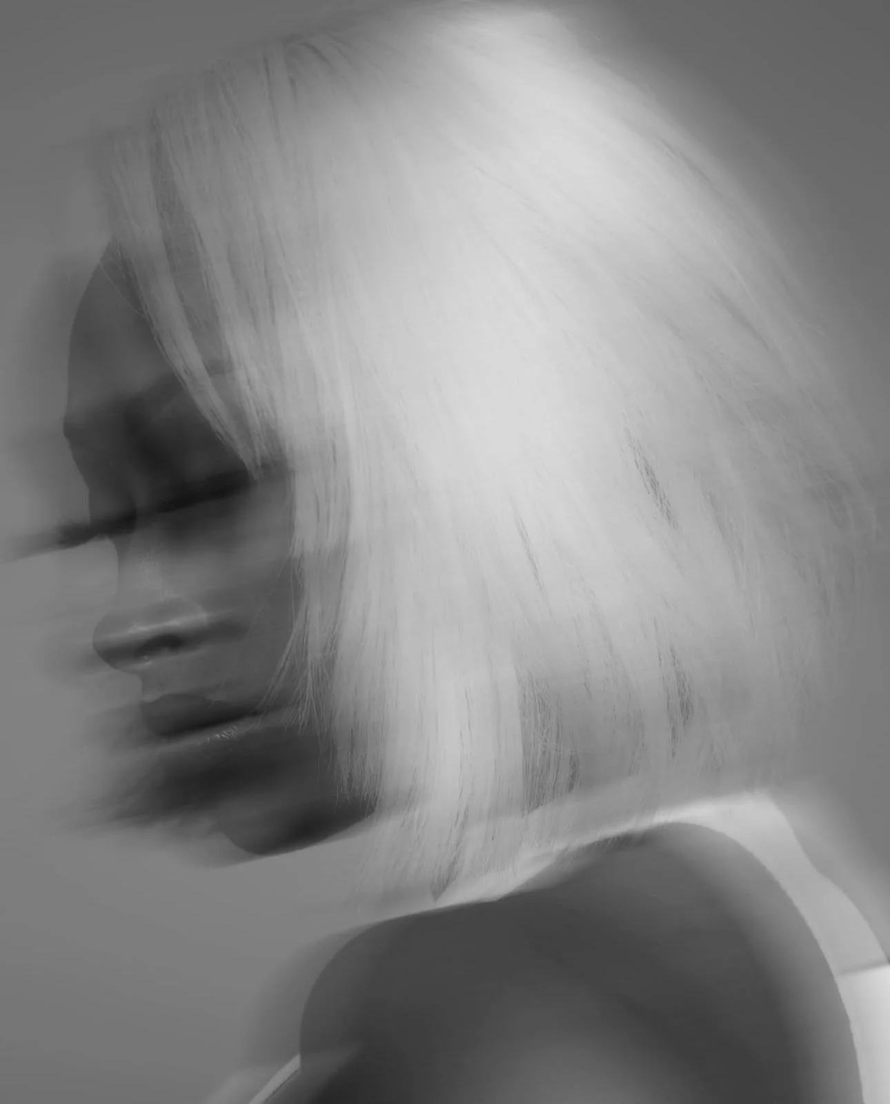 A black and white photo of a woman with platinum blonde hair, wearing a tank top, with her eyes closed and head bowed.