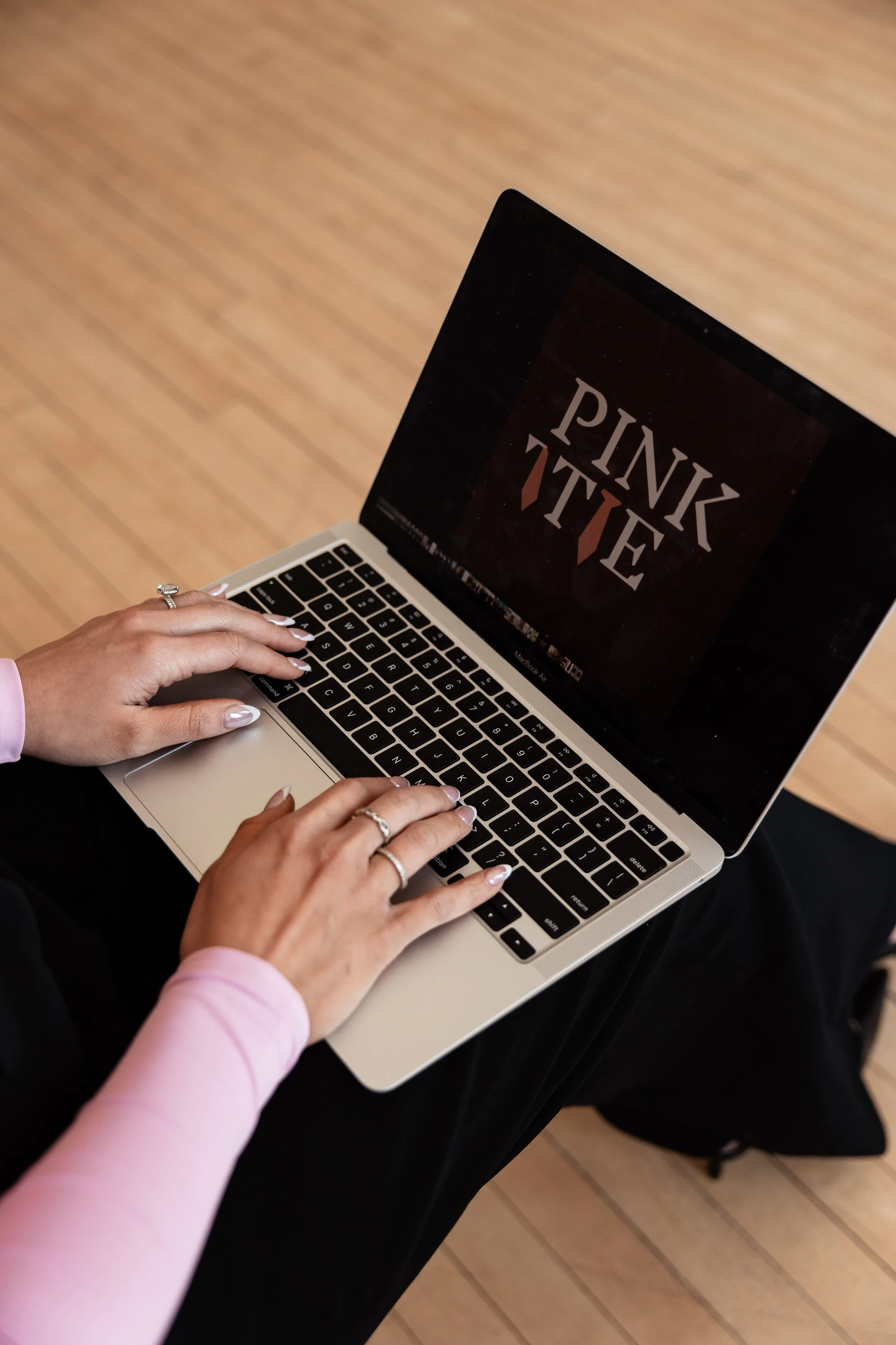 Professional Wedding Planner working on a laptop to ensure a perfect and smooth wedding day.