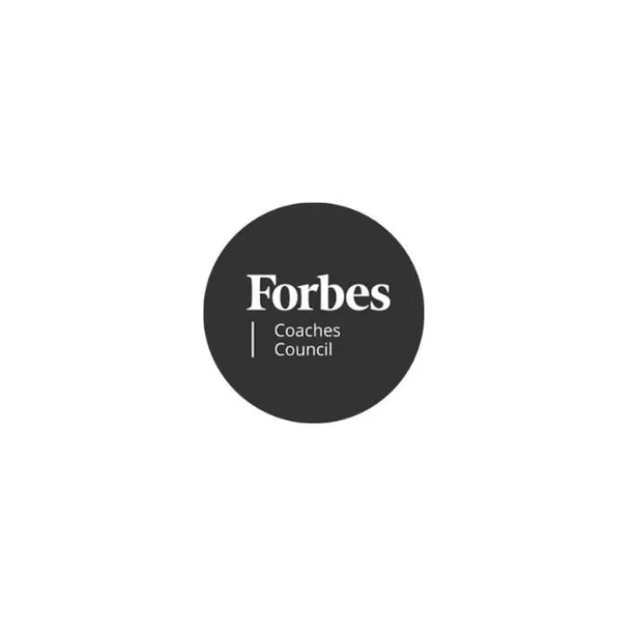 Black circular logo with white text that reads 'Forbes Coaches Council'.