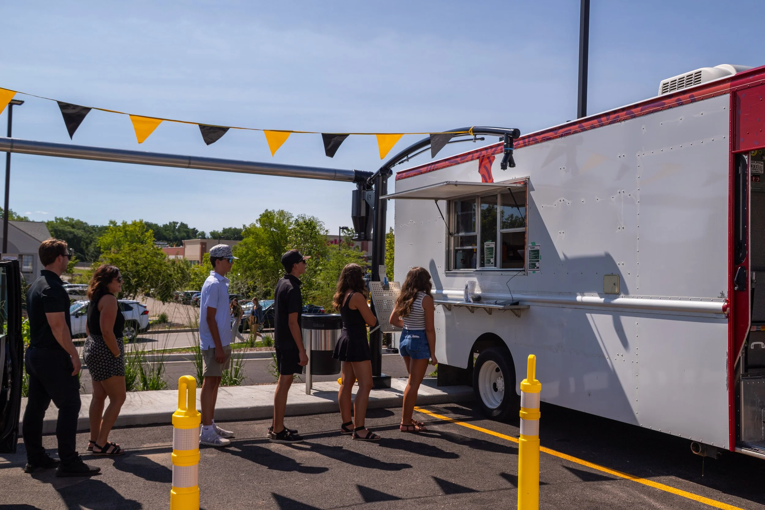 Guests gathered beside the Lavender Haze mobile kitchen
