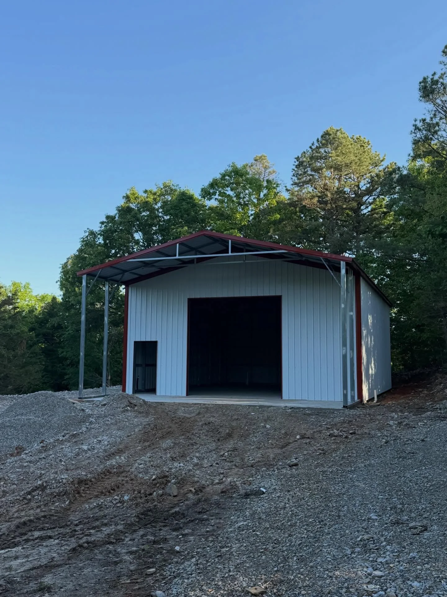 This 30x40x14 shop comes ready to perform with a 30x10 overhang for extra covered space, a framed-out man door for easy access, and a 12x12 garage door opening to handle your equipment with no problem.

Whether it&rsquo;s for storage, a workspace, or