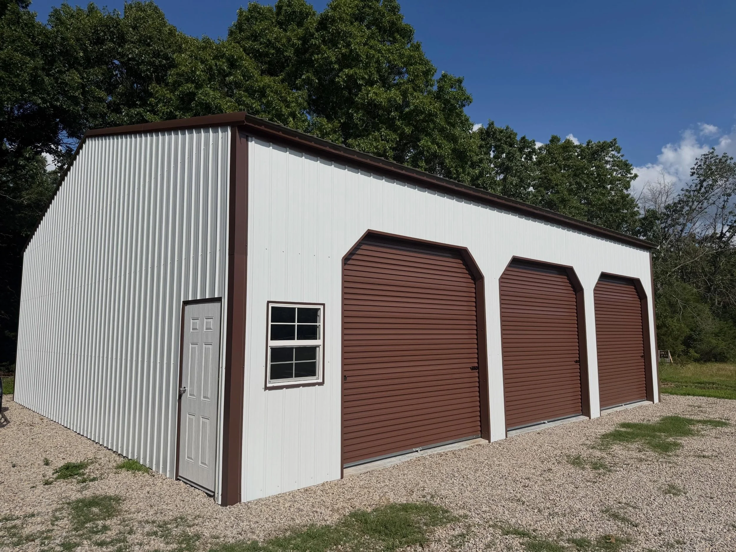 This custom 40x40x12 Ozark Steel Building is ready to handle whatever the owner throws at it! Featuring three 10x10 roll-up doors, a man door, and a window for added convenience and natural light, this shop offers the perfect combination of functiona
