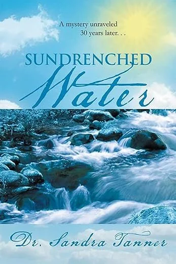 A book cover with the title Sundrenched Water. In shades of blue with a yellow sun. Water is cascading over rocks. on the top a sky with clouds and the sun can be seen. By Dr. Sandra Tanner