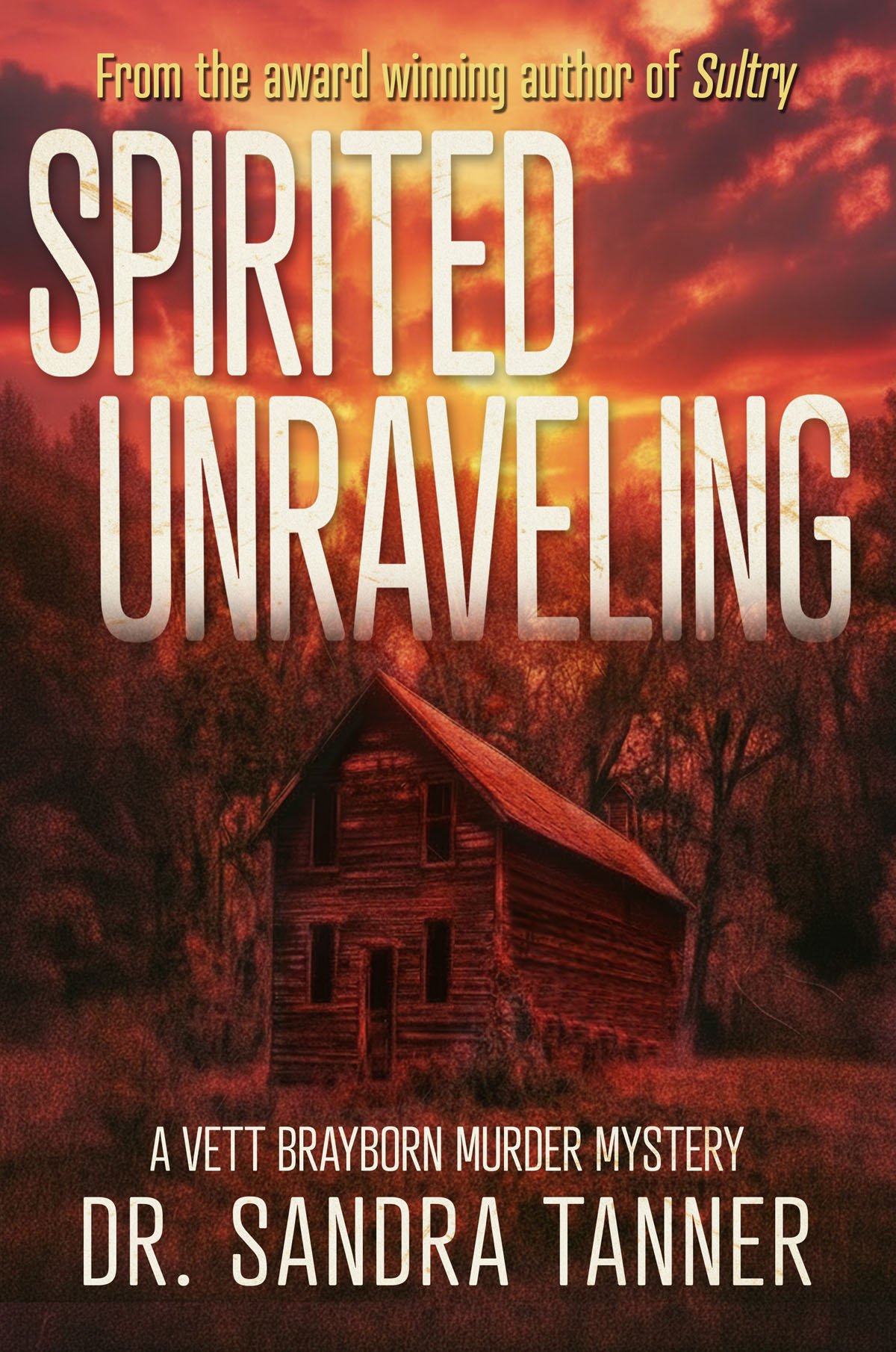 Book cover with title Spirited Unraveling; a distresses cabin in a woods with a red sky. A Vett Brayborn Murder Mystery by Dr. Sandra Tanner