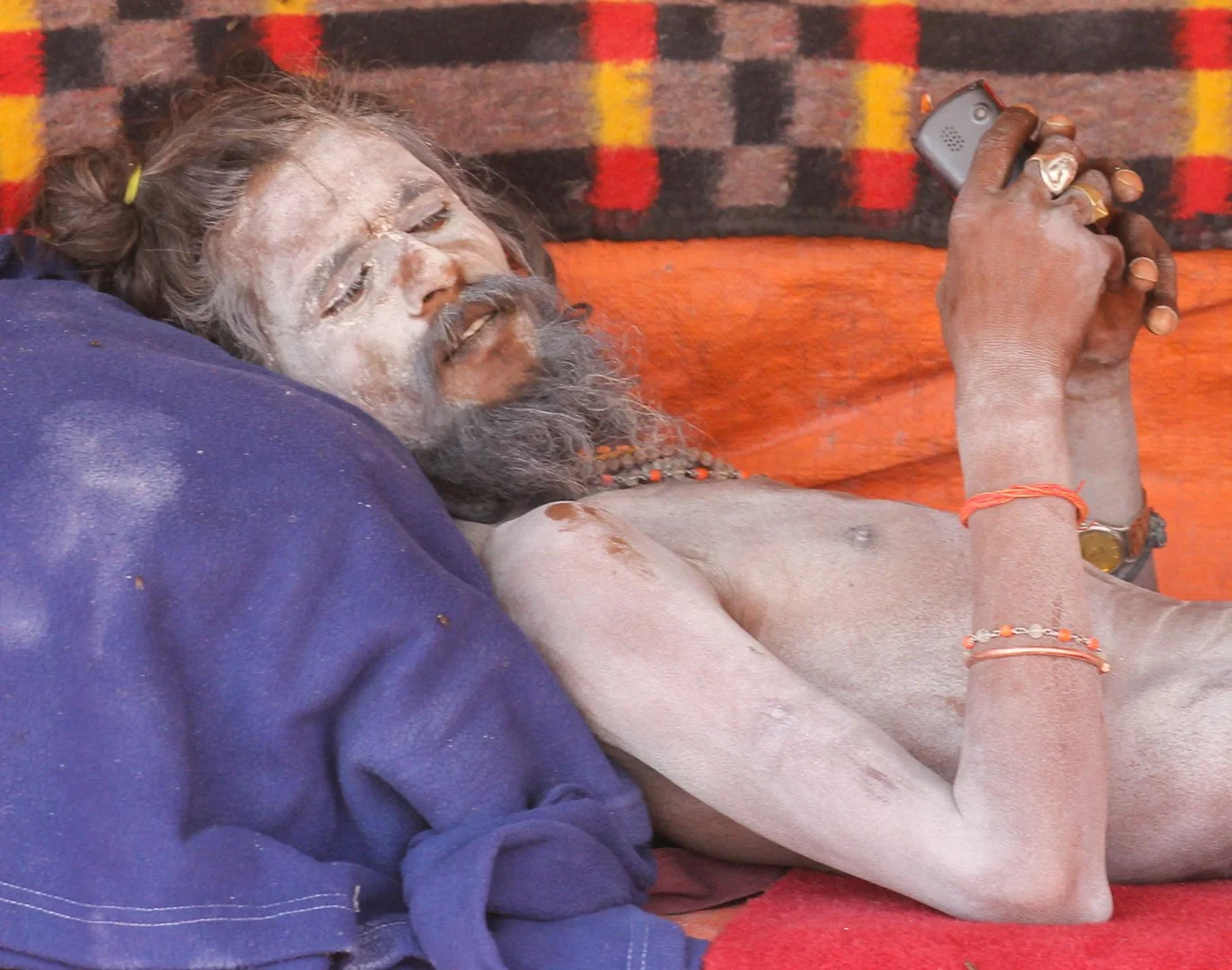 Sadu Holy Man Resting in a tent in Varanasi - Chris Holt
