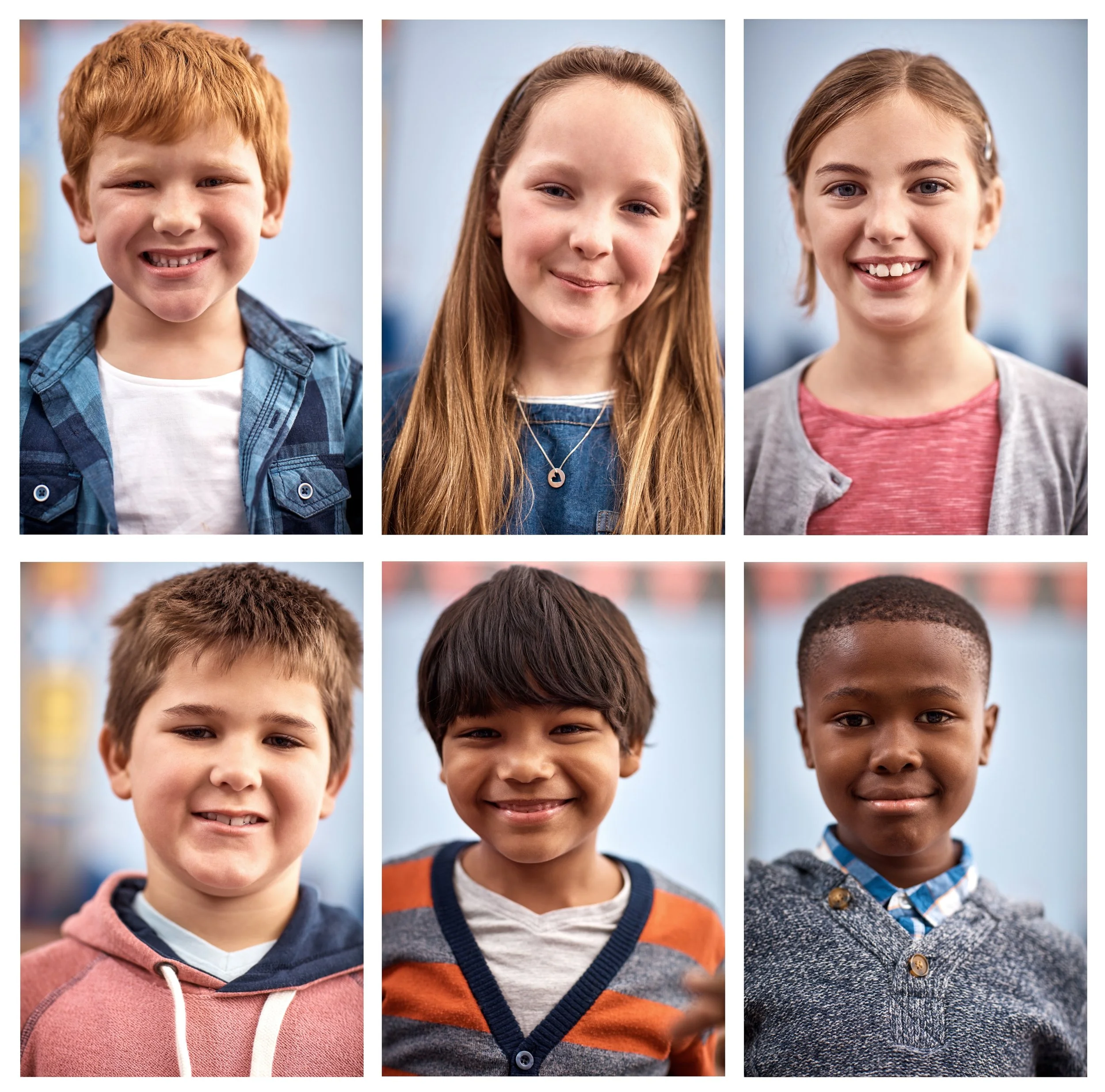 Six children, three boys and three girls, smiling and looking at the camera against a blurred indoor background. The children are diverse in appearance, with different hair colors and styles.