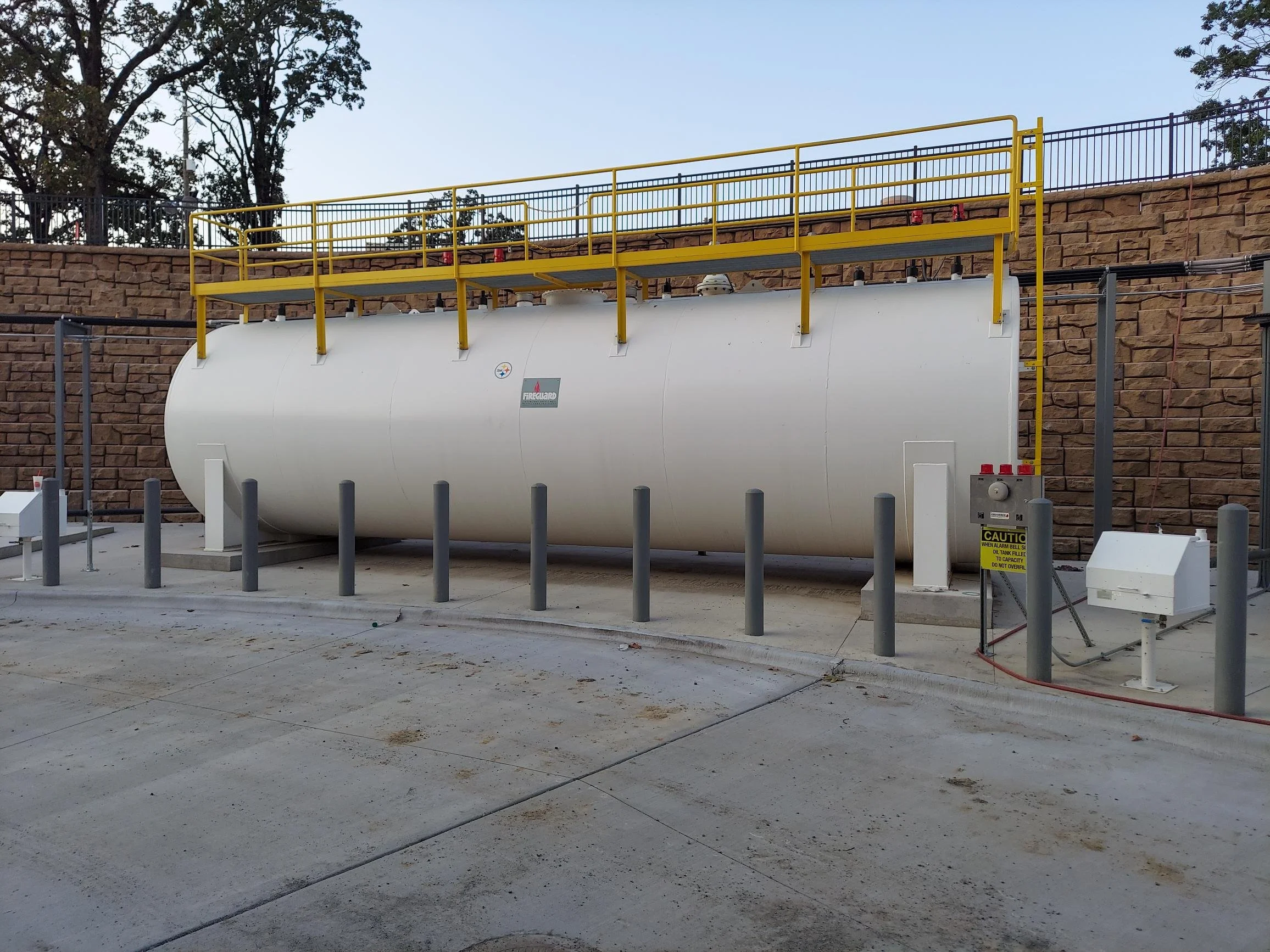 A 30,000 gallon main storage tank with a Preferred FA-AV fill alarm cabinet shown on the right side. Preferred supplied the transfer pumps, tank gauging, and leak detectors for the two tanks included in this project.