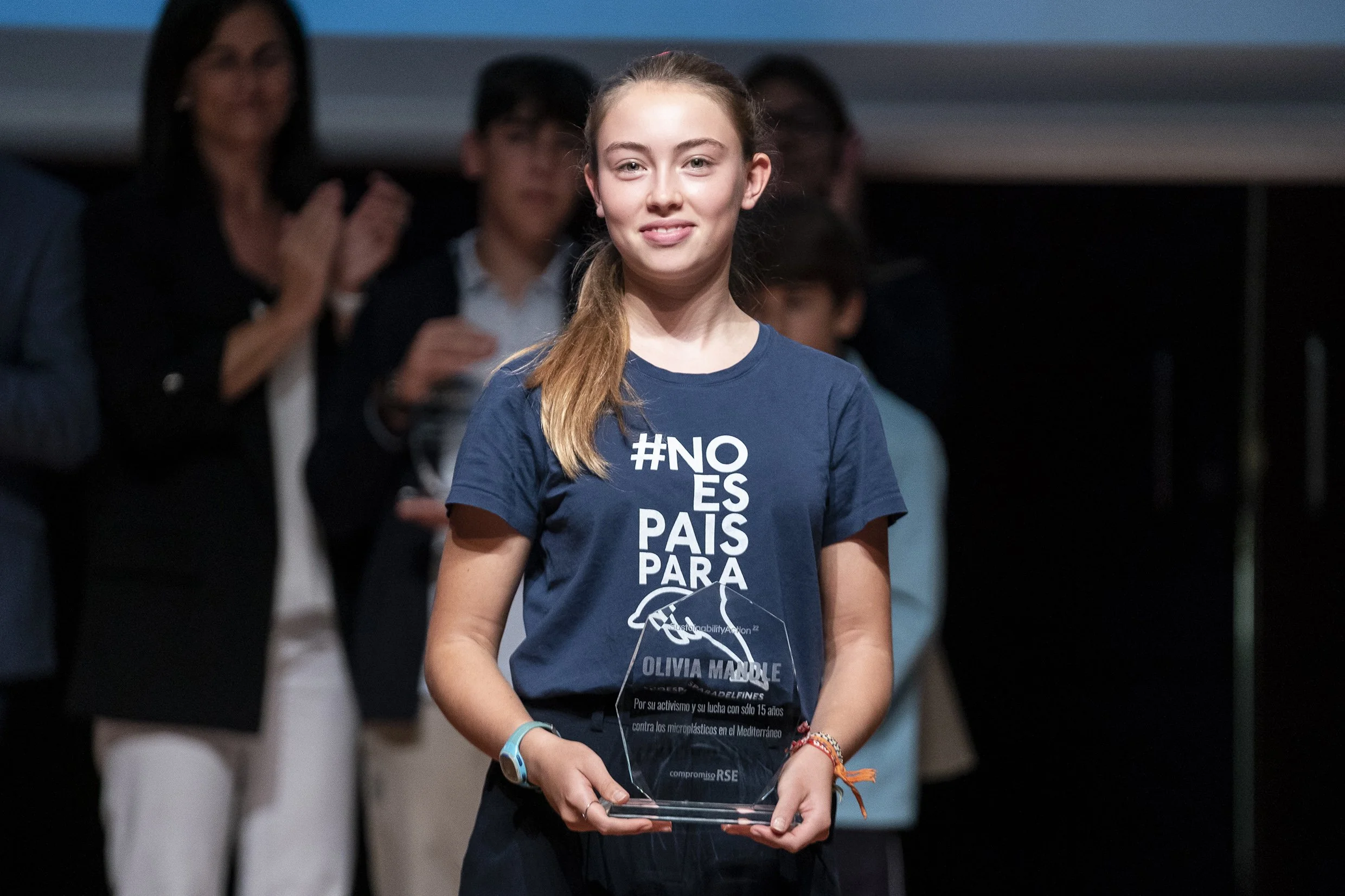Environmental youth activist Olivia Mandle with an award