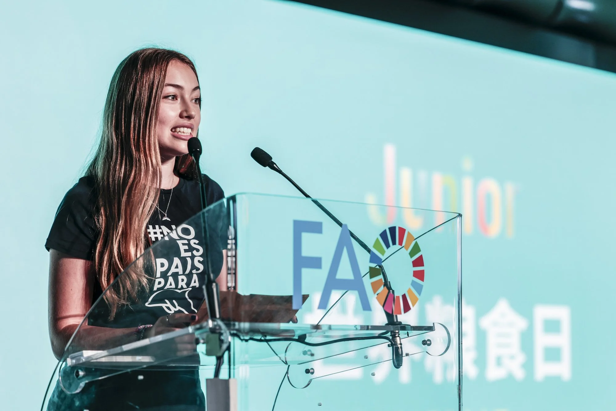 Environmental youth activist Olivia Mandle delivering a keynote address at the UN FAO headquarters in Rome, Italy