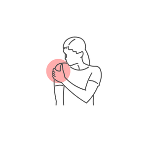 A woman holding a pink basketball with both hands, preparing to shoot or pass.
