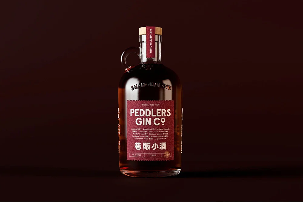 A bottle of Peddlers Barrel Aged Gin from Shanghai, award-winning and crafted for adventurous palates.
