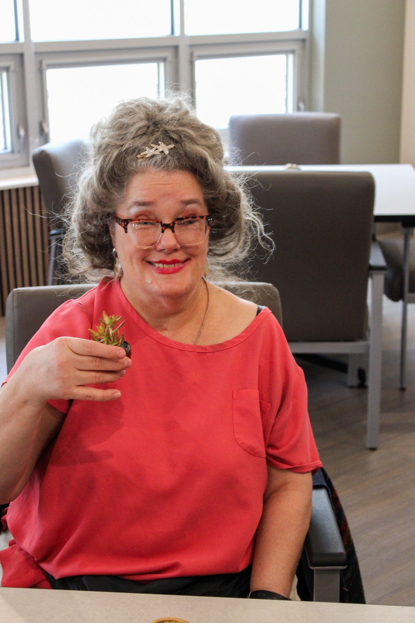 A tbi survivor in the community room at 2730