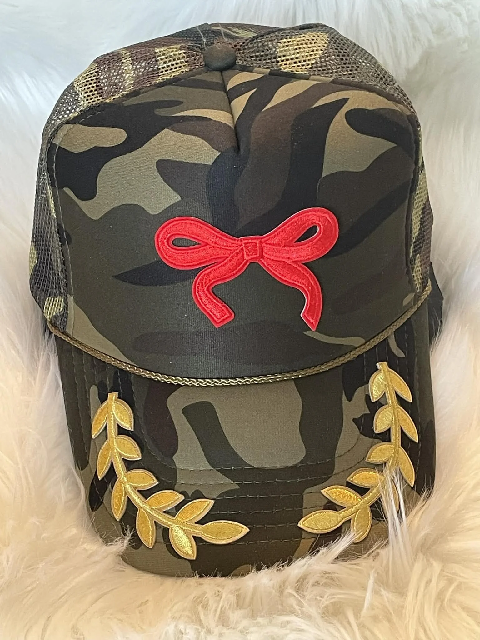 Camo Trucker with red bow and gold wings