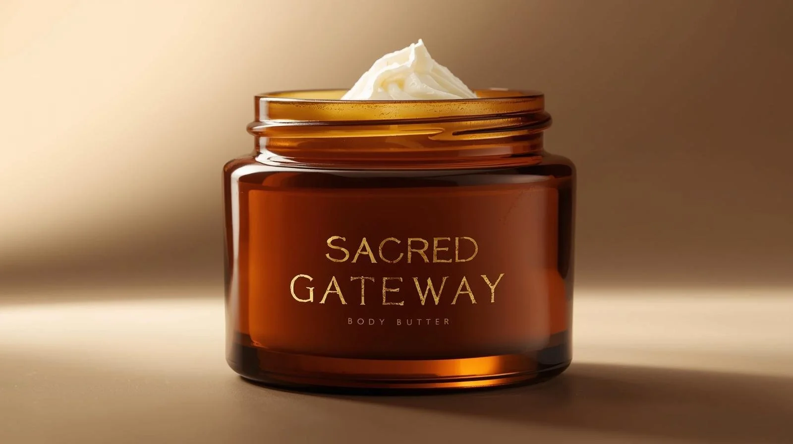 Amber glass Body butter that says sacred gateway in gold.jpeg