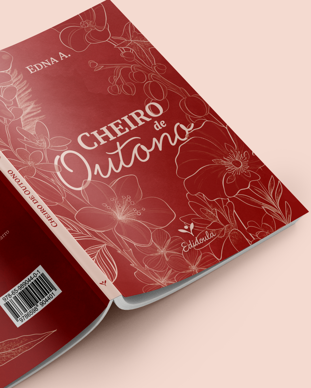 Capa de livro com fundo vermelho, decorada com desenhos de flores brancas, com o título "Cheiro de Outono" e o nome "Edna A." na parte superior esquerda.
