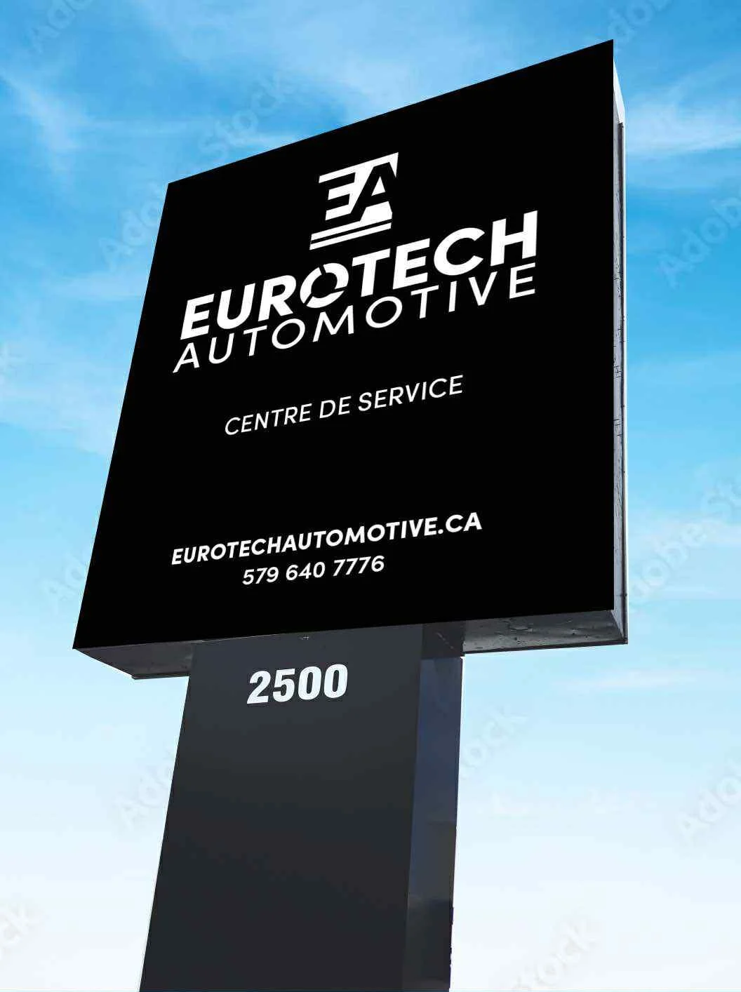 Black billboard sign for Eurotech Automotive with white text, displaying contact information and address against a blue sky background.