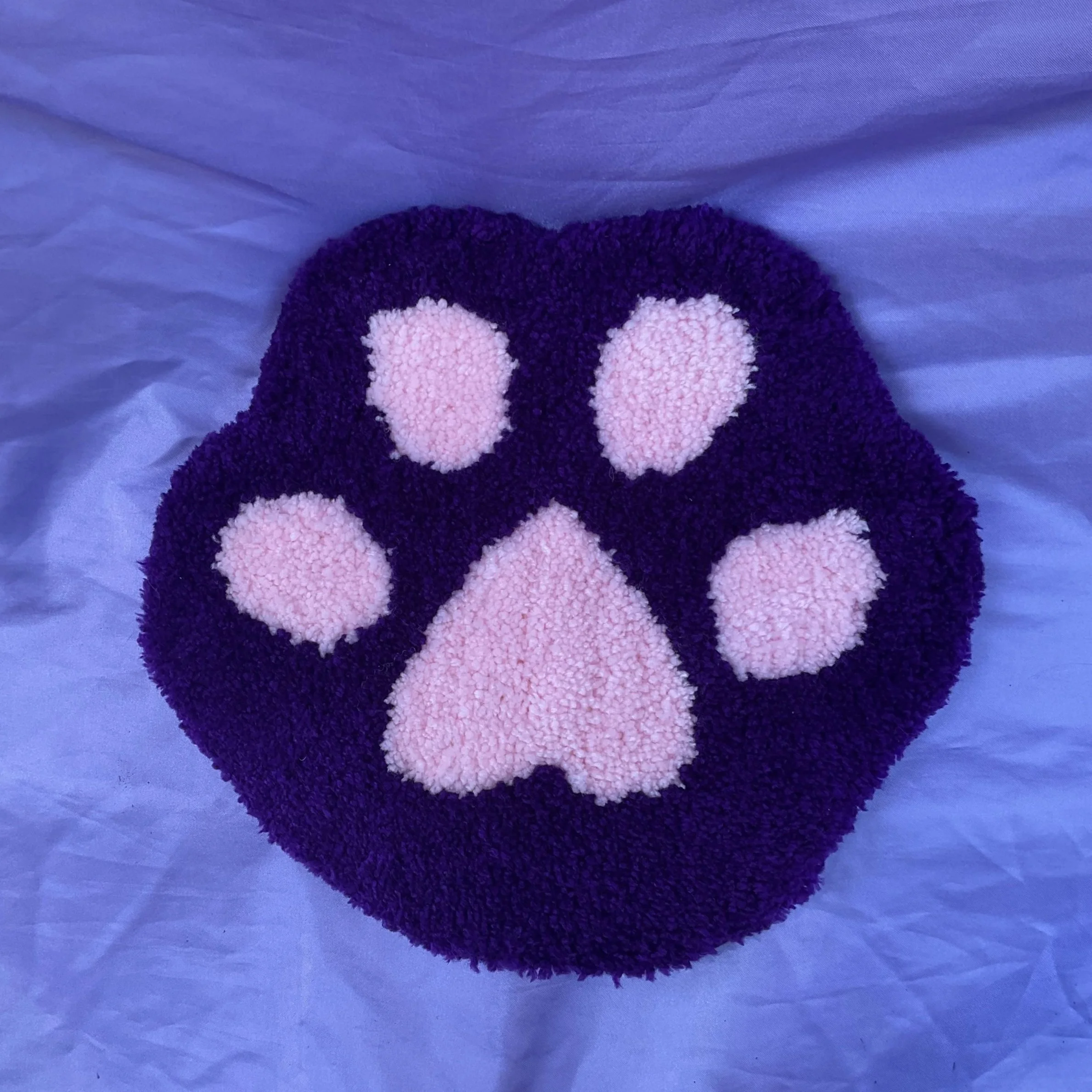 purple paw tufted decor