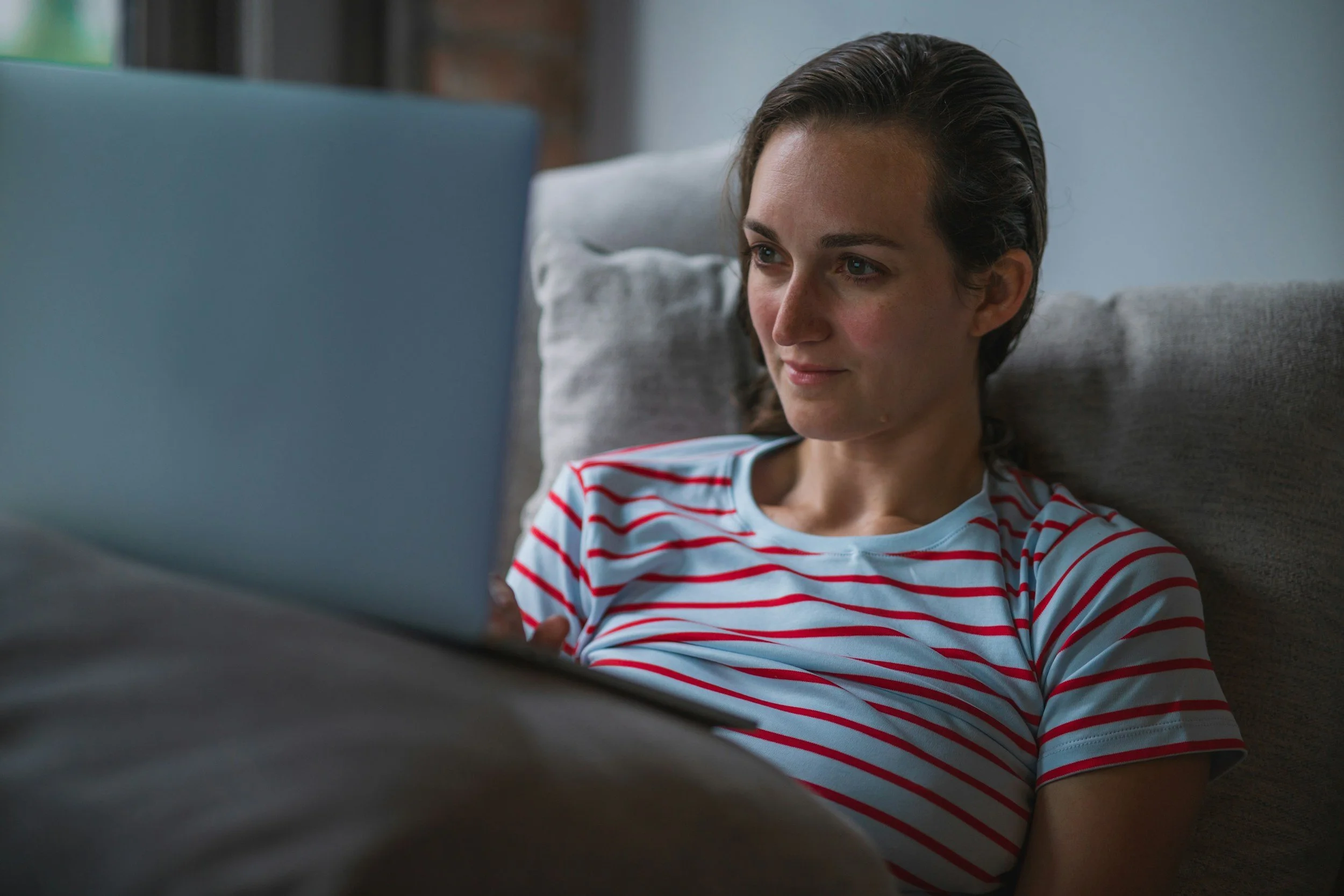 Woman on video call with online therapist discussing responsible child role