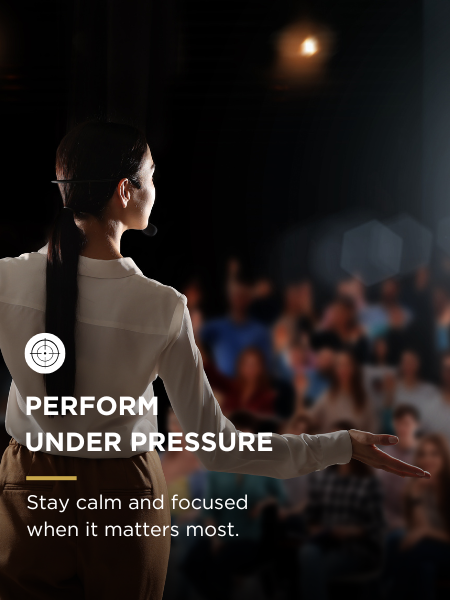 A woman giving a presentation to a seated audience in a dark room with a spotlight. The text overlay reads: 'Perform Under Pressure. Stay calm and focused when it matters most.'