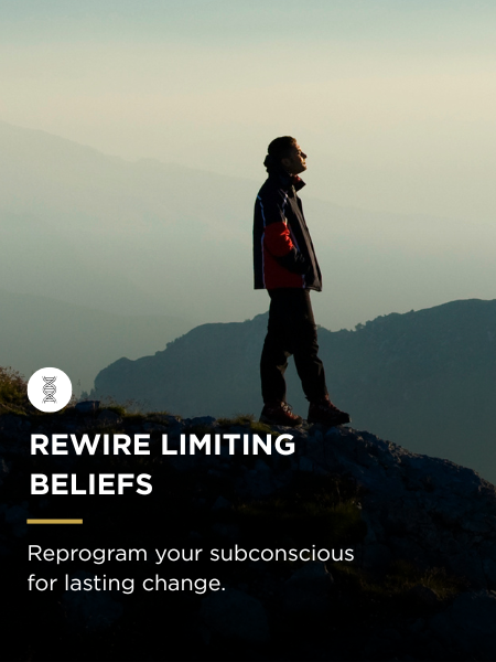 Silhouette of a person standing on a rocky hilltop at sunset, overlooking mountains with a quote about reprogramming subconscious beliefs for lasting change.