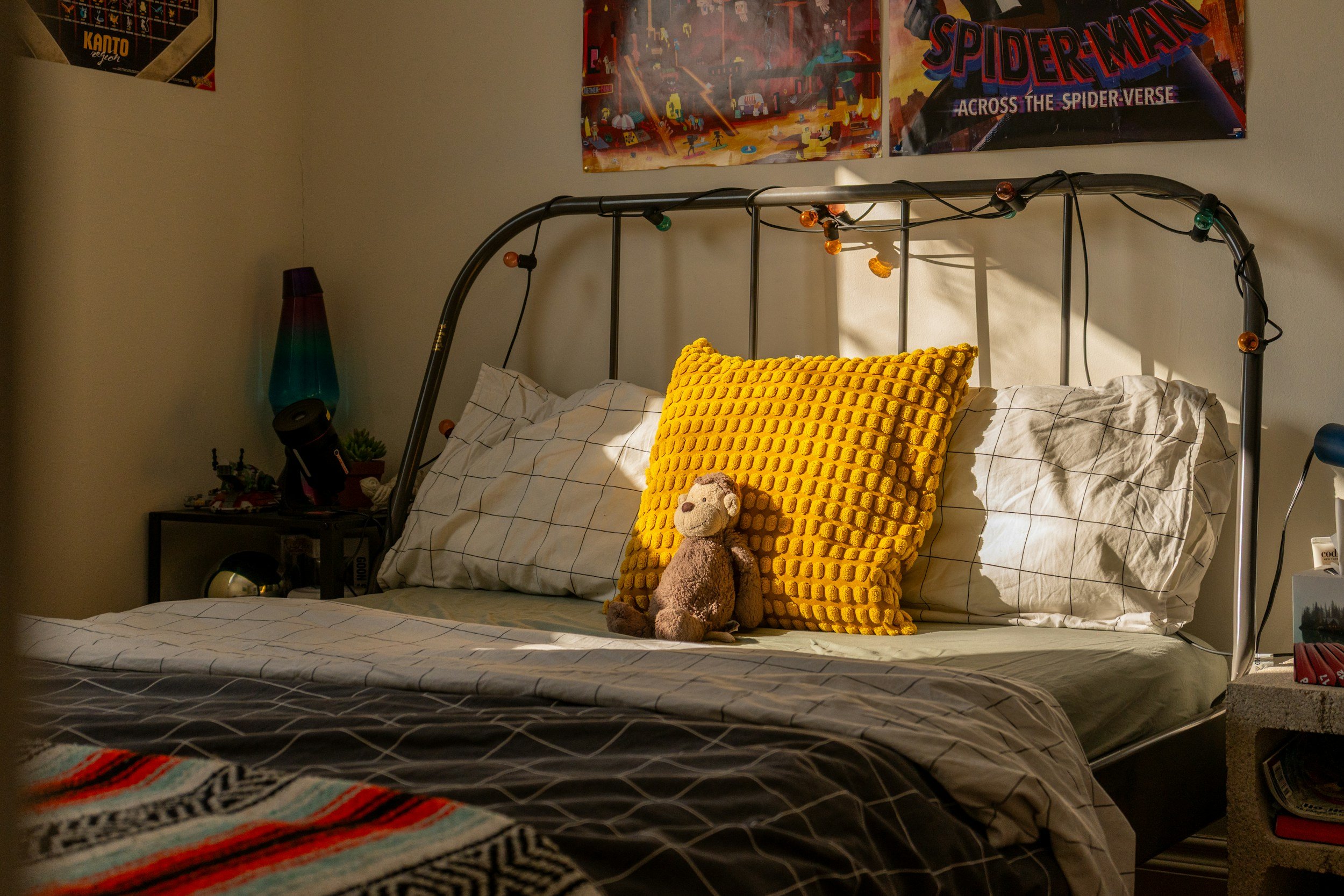 Calm child’s bedroom space with stuffed animal and soft bedding, representing comfort and emotional safety