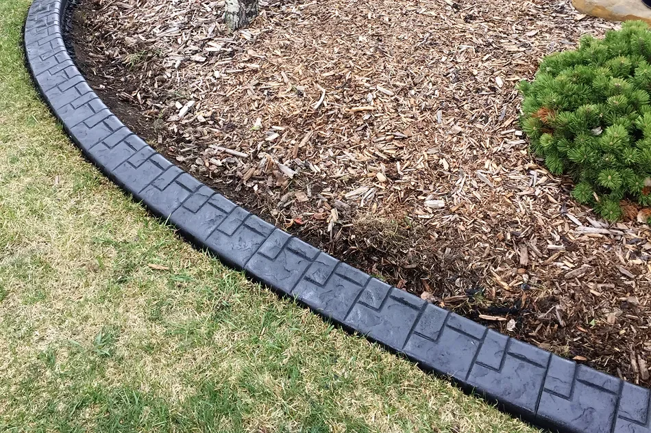 Euro brick concrete curbing shown on edge of garden.
