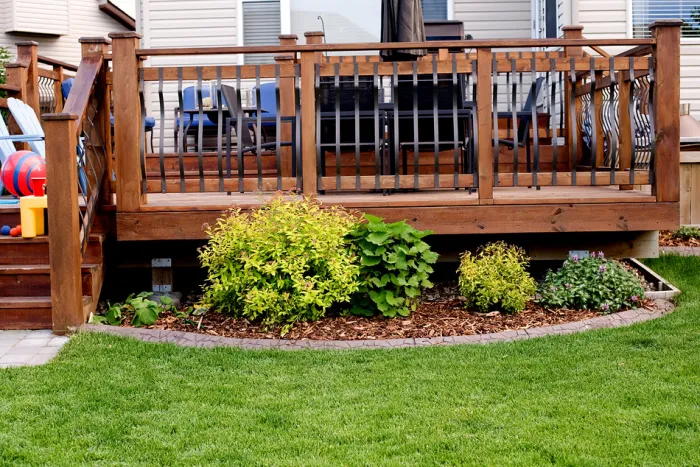 Concrete curbing holding garden mulch and reducing erosion