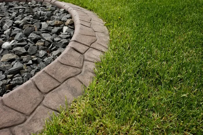Flagstone landscape edging around rock garden in Cochrane 