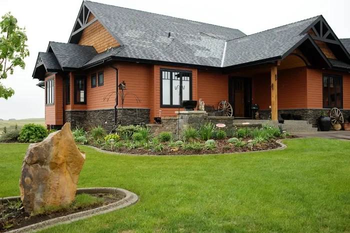 Concrete curbing installed in Okotoks front yard enhancing curb appeal