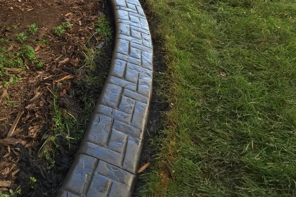 Decorative landscape curbing in the Ashlar style customized by Creative Edge.