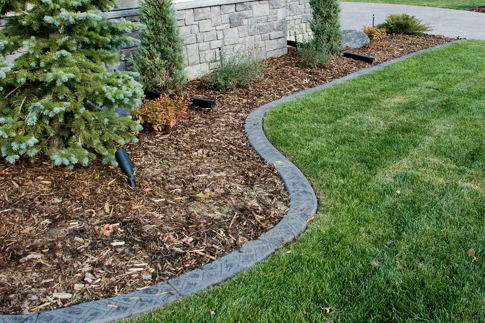 Textured concrete curbing with custom profile by Creative Edge Curbing