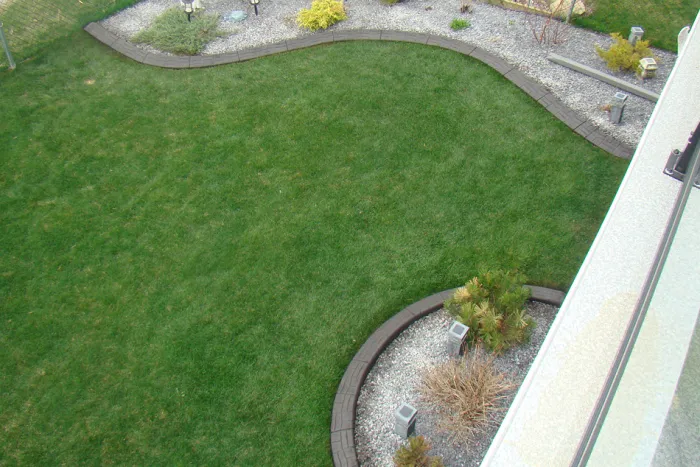 Decorative landscape curbing along backyard in Calgary